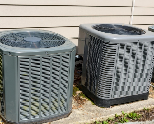 Front view of two residential HVAC units