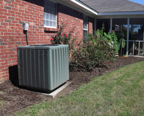 Air Conditioner system next to a home